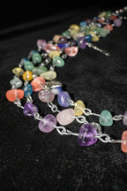 Whimsical crystal chain belt with amethyst, rose quartz, calcite, sodalite, and lapis lazuli charms.