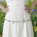 Whimsical crystal chain belt with amethyst, rose quartz, calcite, sodalite, and lapis lazuli charms.