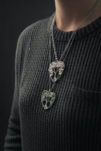 Quartz Tree of Life necklace suspended in a raw crystal heart with natural stone texture