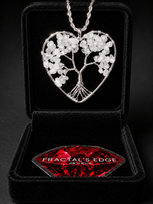 Wire wrapped crystal tree of life pendant necklace with intricate branch details on a dark surface