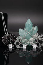 Close-up of Crystalline Roots wire wrapped tree of life pendant – garnet or quartz crystal and wire detail