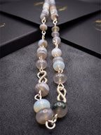 Jelly Botswana agate beaded necklace with natural banding and translucent glow.