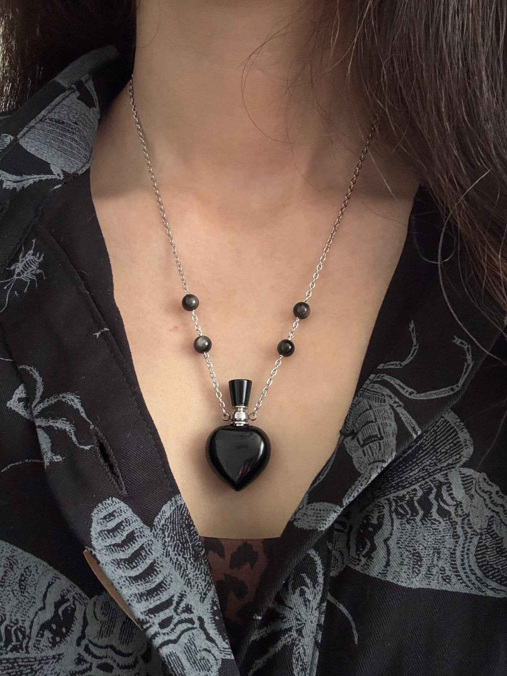Close-up of Obsidian Mystery Reservoir miniature bottle pendant – gothic black crystal detail by Fractal's Edge Jewels
