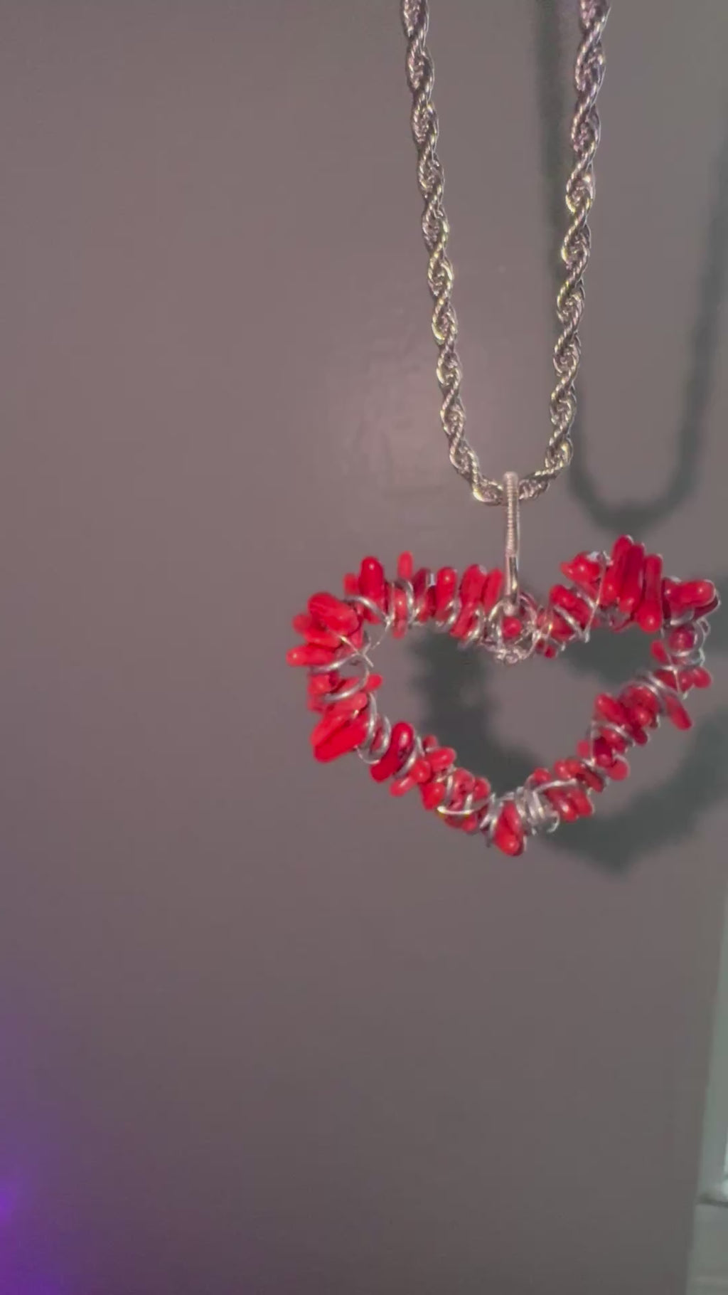 Red coral pendant necklace with stainless steel rope chain and vibrant natural texture.